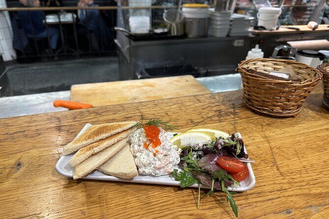Stockholm Small Group Food Tour with 7 Classic Food Tastings - Drottninggatan and the bridge walk toward Norrmalm